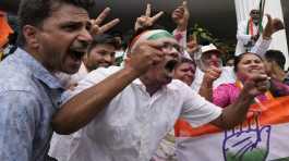 Supporters of opposition Congress party celebrate early leads