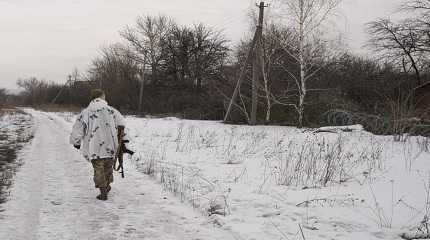 Ukrainian serviceman walks to a frontline