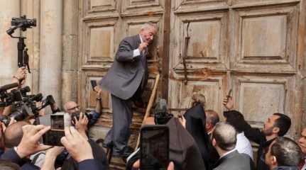 custodian in charge of the ancient key to Church of Holy Sepulchre