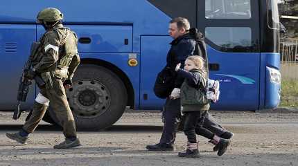 A man and a girl who left a shelter in the Metallurgical Combine Azovstal