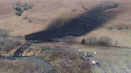 Emergency crews work to clean up the largest U.S. crude oil spill in nearly a decade