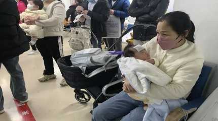 woman tends to a child at the clinic