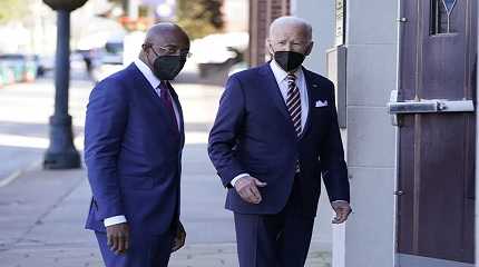 Joe Biden and Sen Raphael Warnock