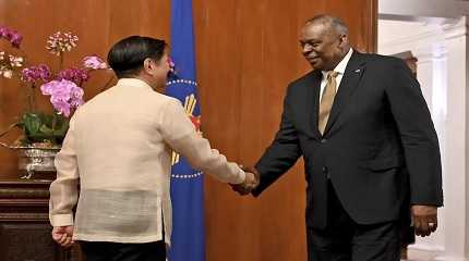 Lloyd James Austin III shake hands Ferdinand Marcos