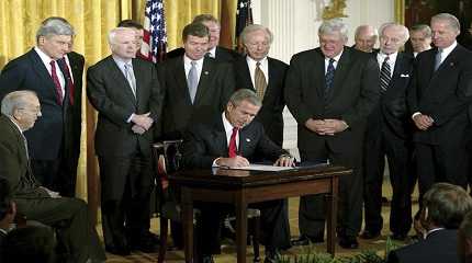 George W. Bush signs a resolution