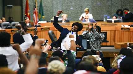 Justin Pearson celebrates with supporters