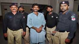 Police officers arrest Waseem Azeem