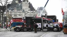 Trucks, are parked in front of the Chateau Laurier as a protest against COVID-19 restrictions