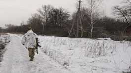 Ukrainian serviceman walks to a frontline