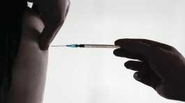 doctor injects vaccination