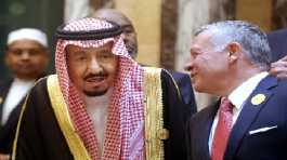 Jordan's King Abdullah II, right, talks to Saudi King Salman