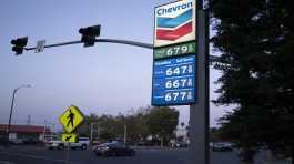 Gasoline and diesel prices are displayed at a gas station