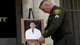 Sheriff's Sgt. Scott Steinle displays a photo of Dr. John Cheng