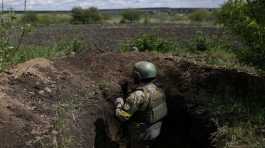 Ukrainian serviceman Shaba stays at a trench 