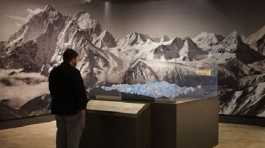 man visits an exhibition titled Everest Ascent to Glory