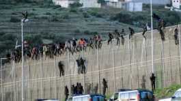Migrants on Morocco - Spain fence at Melilla
