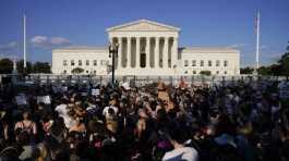 Protesters fill the street in front of the Supreme Court