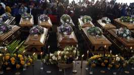 coffins during a funeral service
