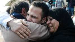 Egyptian man embraces parents after release from prison