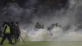 clashes between fans during a Indonesian soccer match