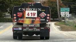 A fuel delivery truck advertises its price for a gallon of heating oil,