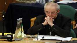 Archbishop of Canterbury Justin Welby listens to debate