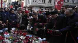 Turkish communities put flowers over a memorial placed