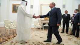 Vladimir Putin shakes hands with Sheikh Mohammed bin Zayed al Nahyan