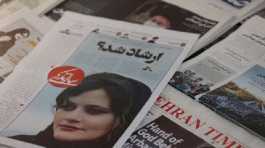 newspaper with a cover picture of Mahsa Amini