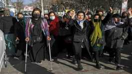 Afghan women chant slogans during a protest