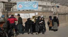 Afghan women students stand outside the Kabul University