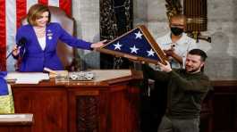 Volodymyr Zelenskiy receives a U.S. flag Nancy Pelosi