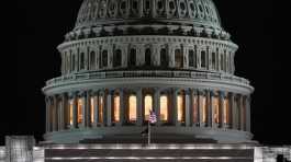 American flags flies on the U.S. Capitol