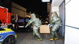 Men in protective suits 