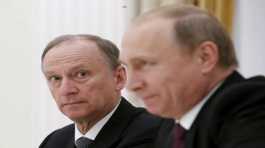 Nikolai Patrushev looks at Vladimir Putin