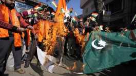 Rajouri district of Indian-controlled Kashmir burn Pakistan flag during a protest in Jammu