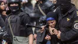 Egypt police arresting woman