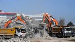 Excavators clear earthquake debris