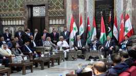 Syrian parliament members and Hammouda Sabbagh meet with a delegation from the Arab 