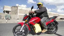 man rides an electric motorcycle