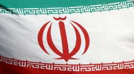 Iranian flag waves.