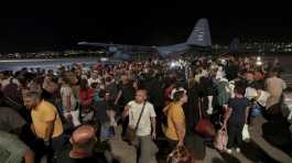 Jordanians evacuated from Sudan arrive at a military airport in Amman