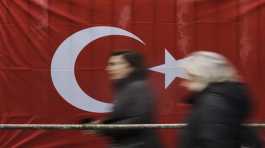 Turkish citizens living in Germany arrive at a polling station