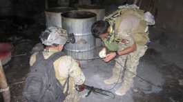 Afghan narcotics police destroyed a drug processing lab