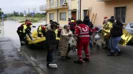 Firefighters use a dinghy to evacuate people