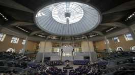 German lawmakers attend a debate at the parliament Bundestag