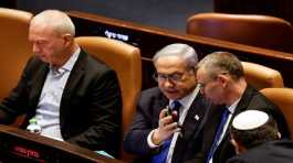 Benjamin Netanyahu shows Yariv Levin his phone