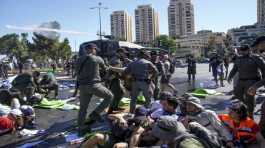 Israeli police disperse demonstrators blocking the road