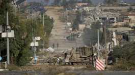 Israeli soldiers stand on Gaza strip
