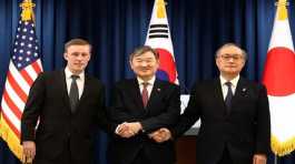 South Korea's Cho Tae-yong with U.S. Advisor Jake Sullivan and Japan's Takeo Akiba
